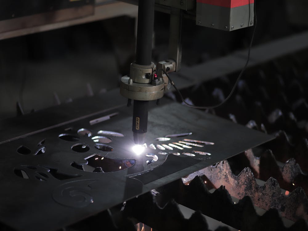 Plasma cutting machine working on steel sheet